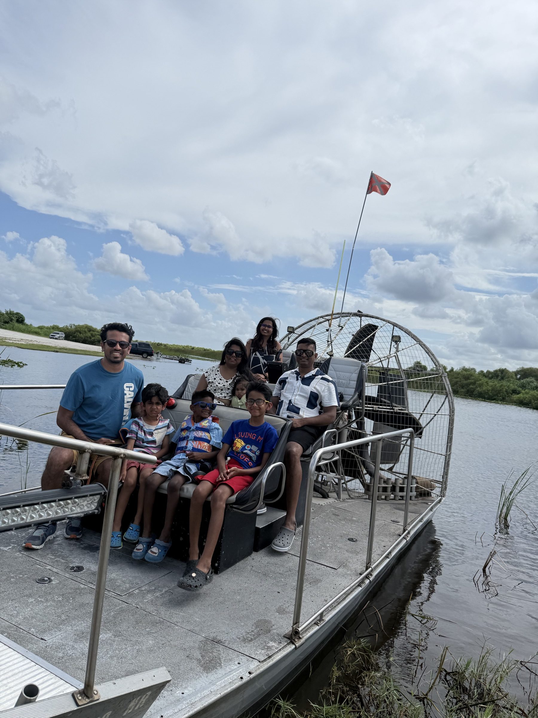 A family of five enjoying an Everglades airboat tour with Aces Airboat Tours near Fort Lauderdale