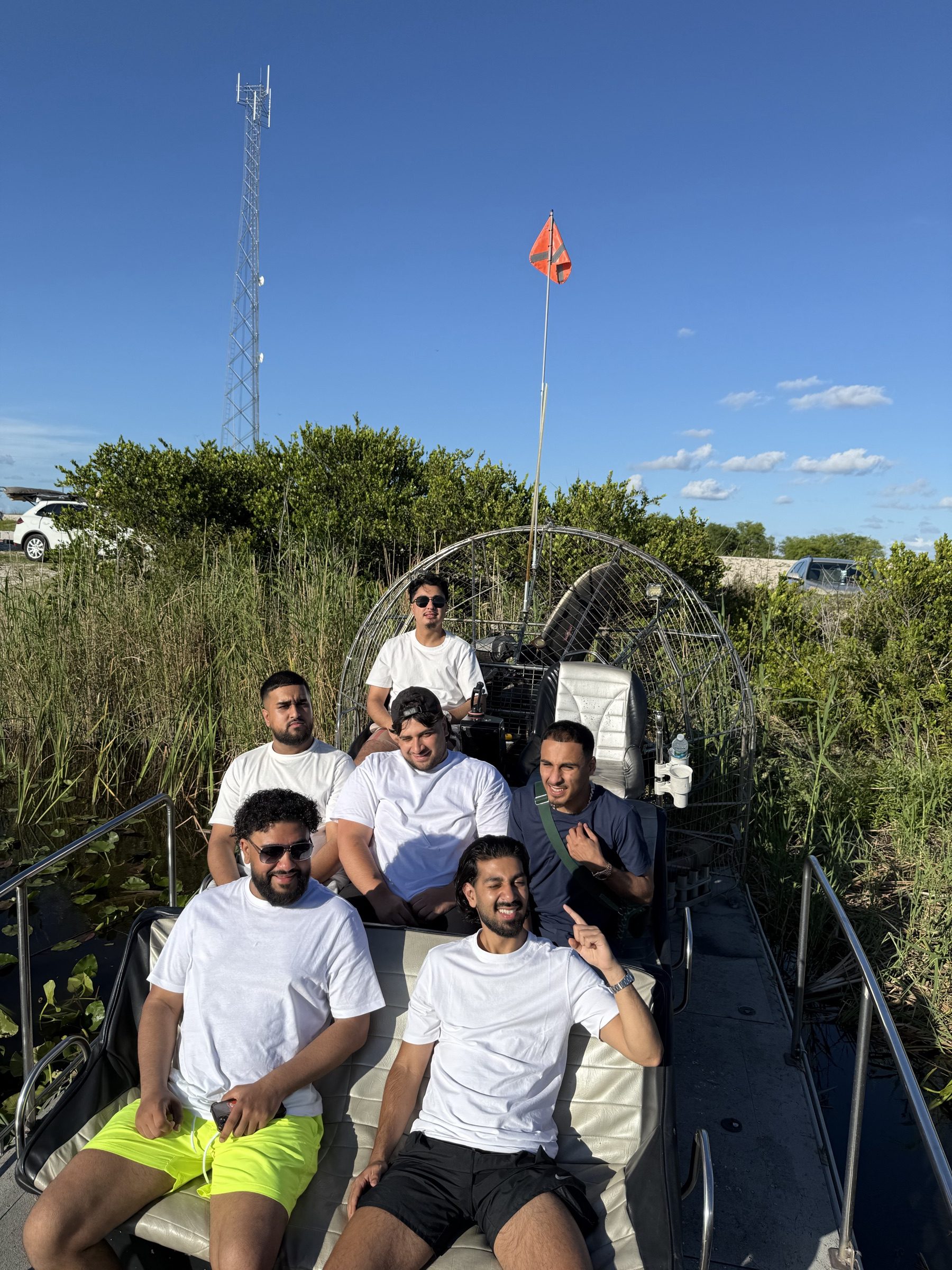 A group of friends on a private group airboat tour of the Florida Everglades