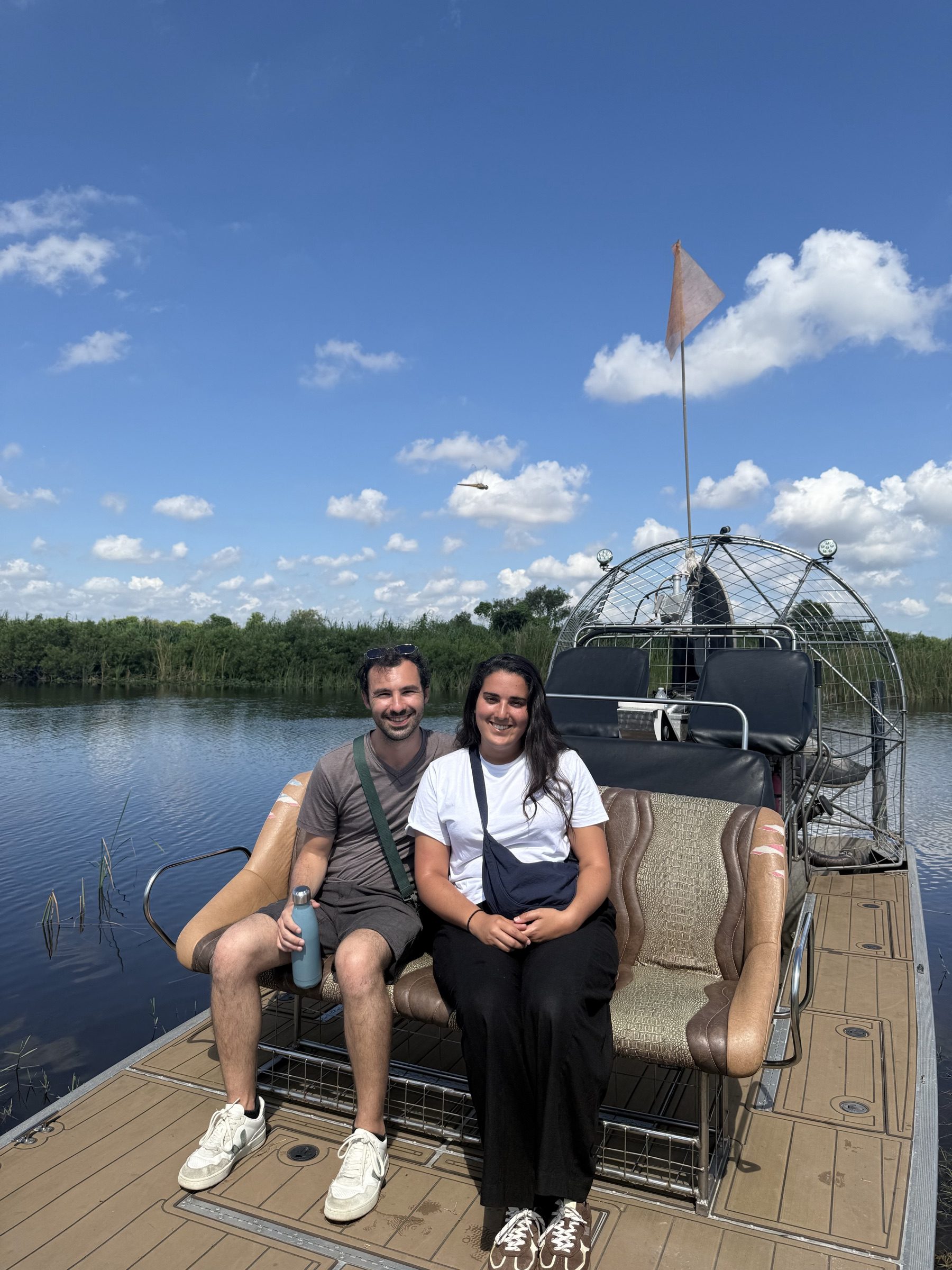 A couple enjoying a romantic Everglades sunset airboat tour with Aces Airboat Tours