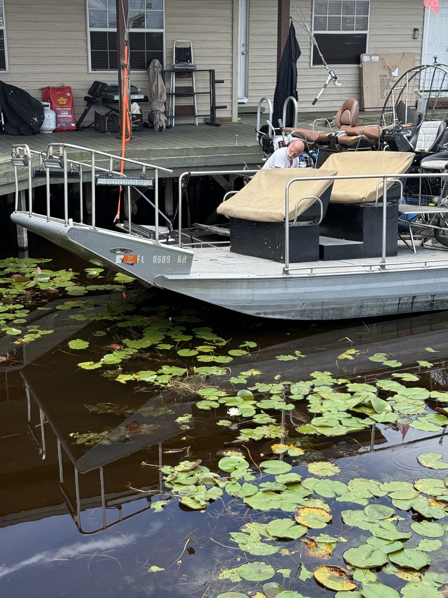 An Aces Airboat Tours airboat docked and ready for an Everglades tour