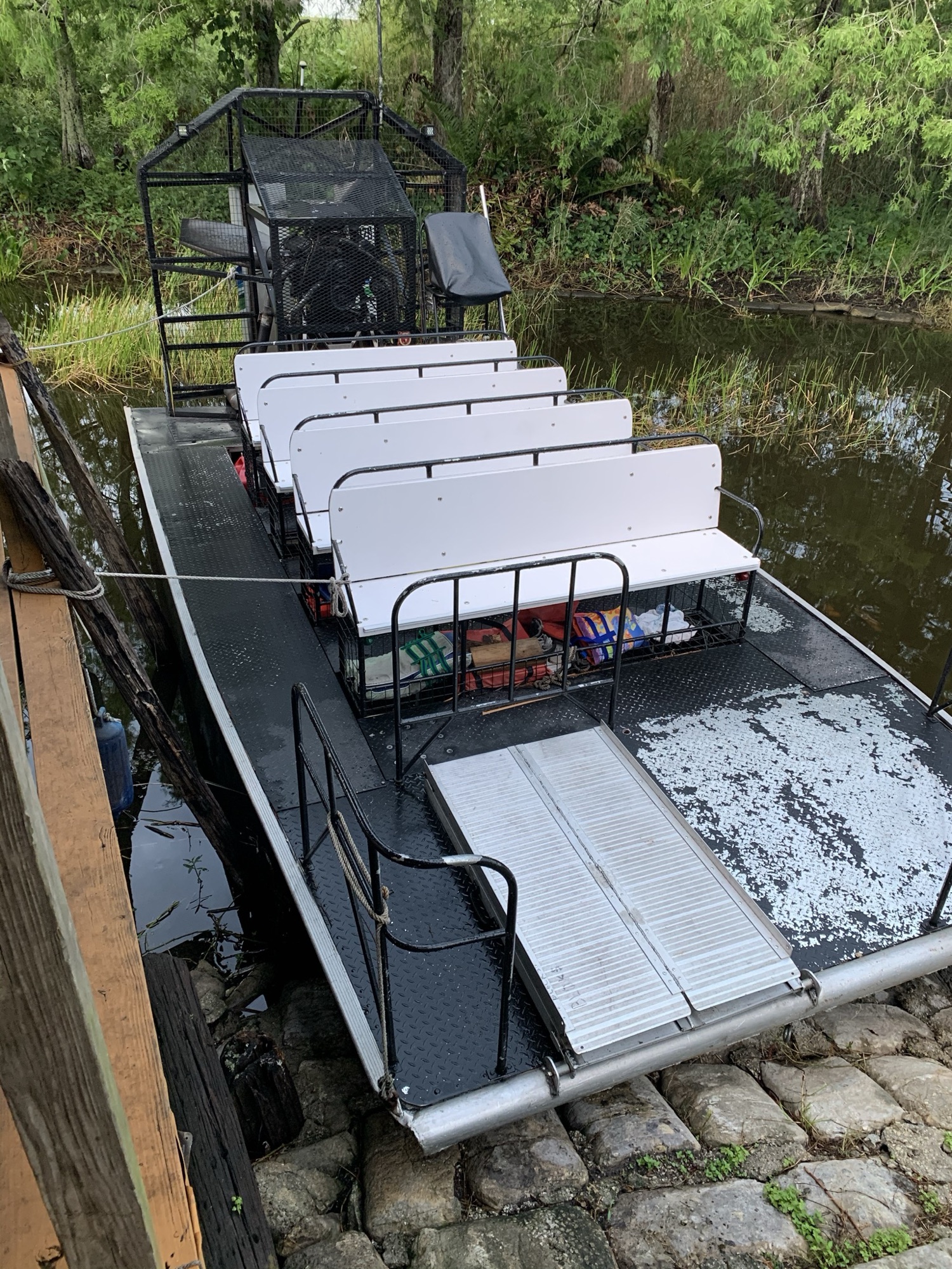 An empty Aces airboat with comfortable seating ready for a tour