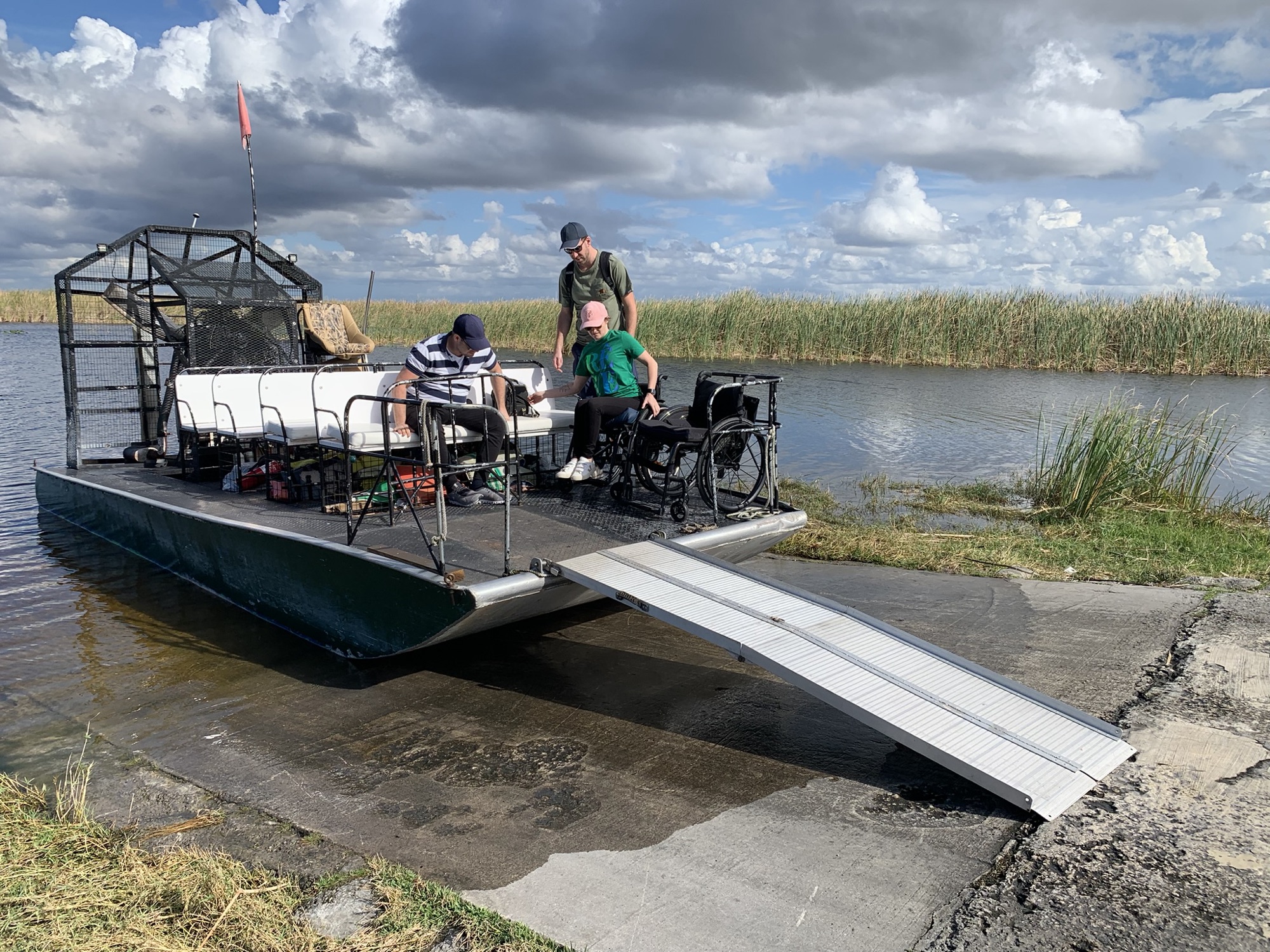An Aces airboat fitted with a wheelchair-accessible boarding ramp