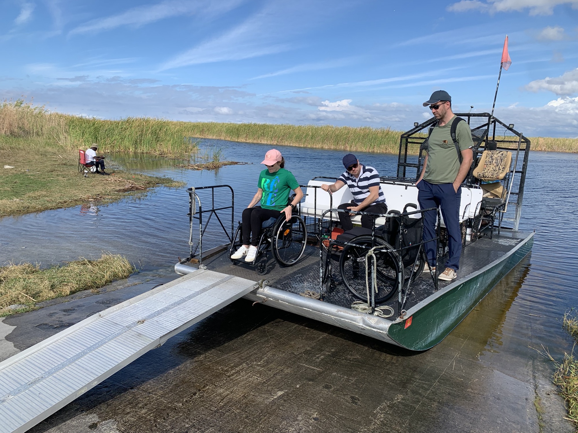 An Aces captain and guests on an Everglades airboat tour