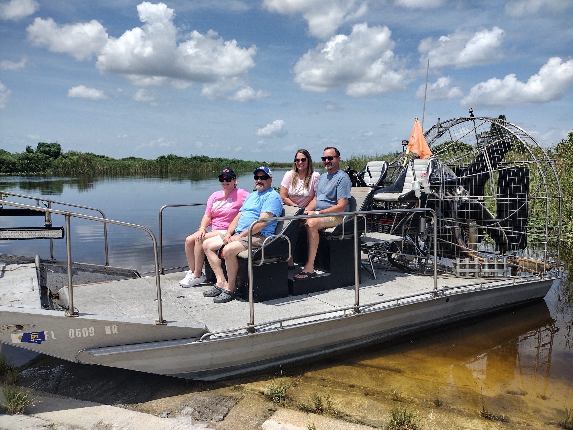 A family group enjoying an Aces Everglades airboat tour