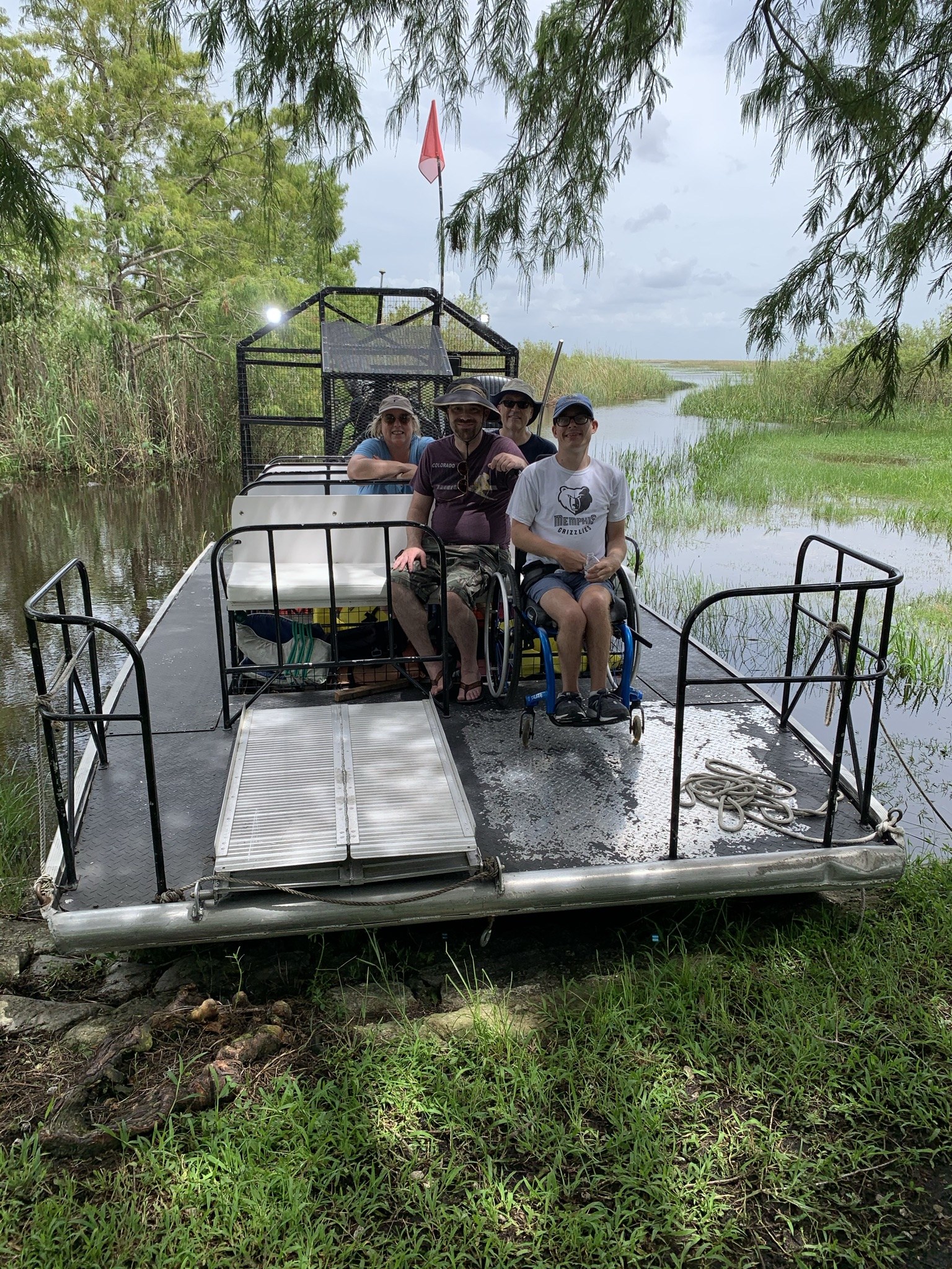 Guests boarding a private Aces airboat at the dock on the western edge of Broward