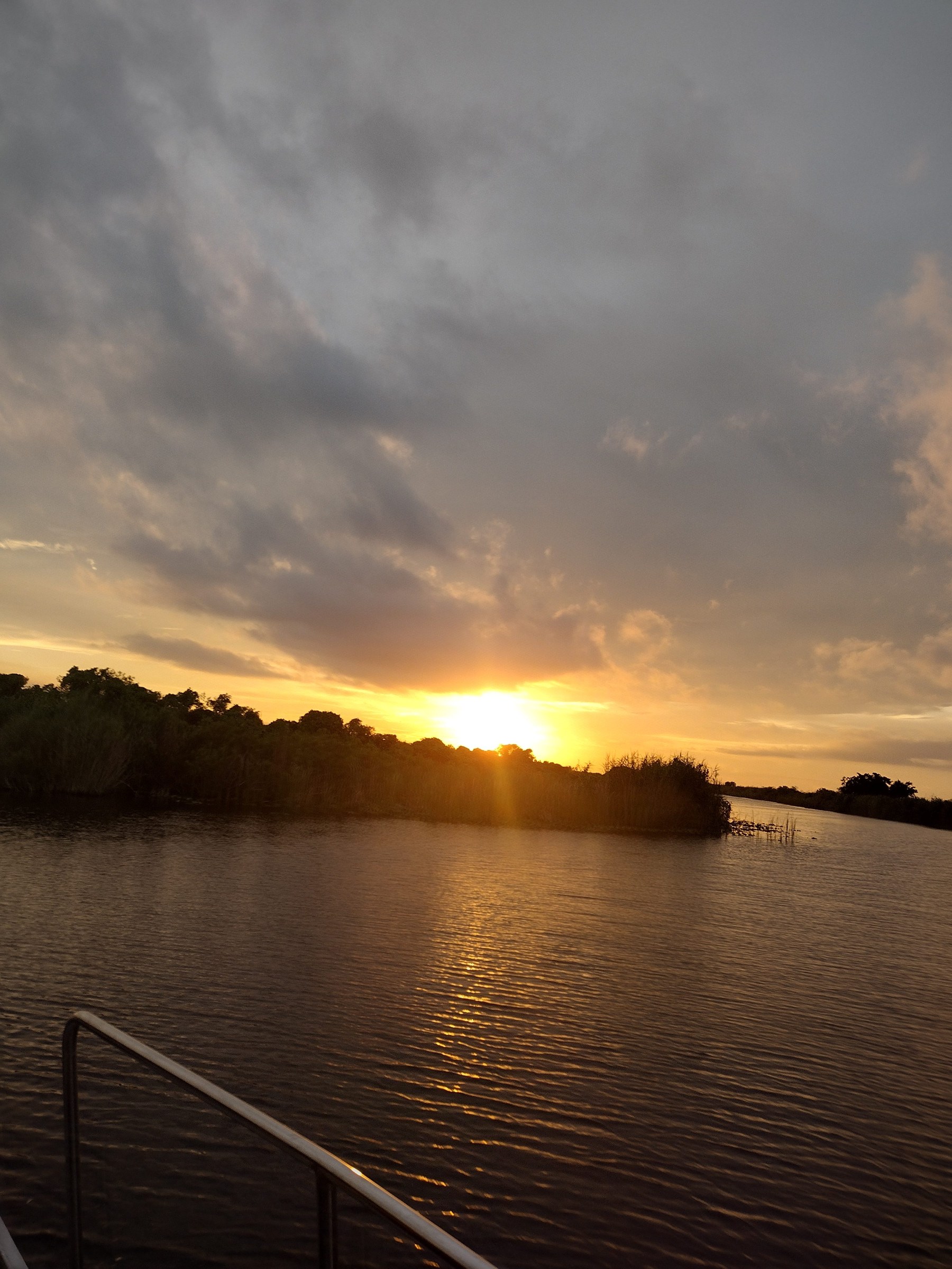 Glowing sunset over open Everglades water on one of our evening airboat tours
